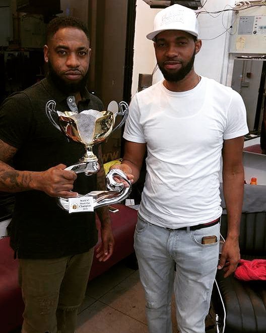 DJ Danger and DJ Genius, RTMRADIO.NET World 45 Shoot Out Champions 2016, holding their trophy